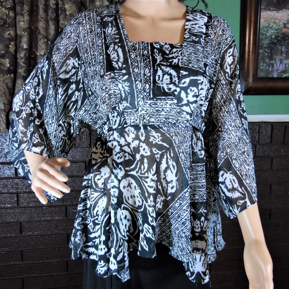 Apostrophe sheer top